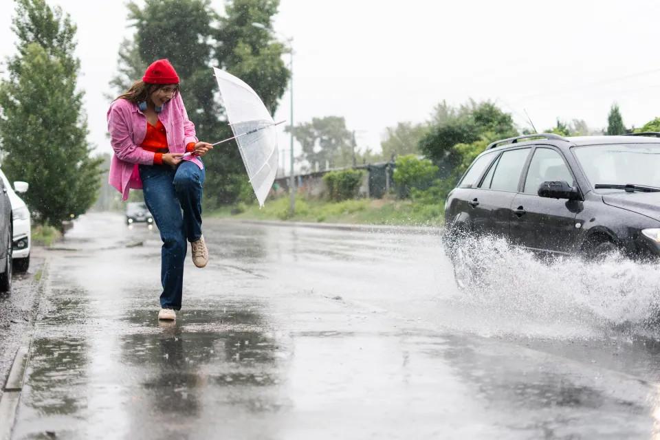 car splashing pedestrian outdoors scared 1037027045.webp